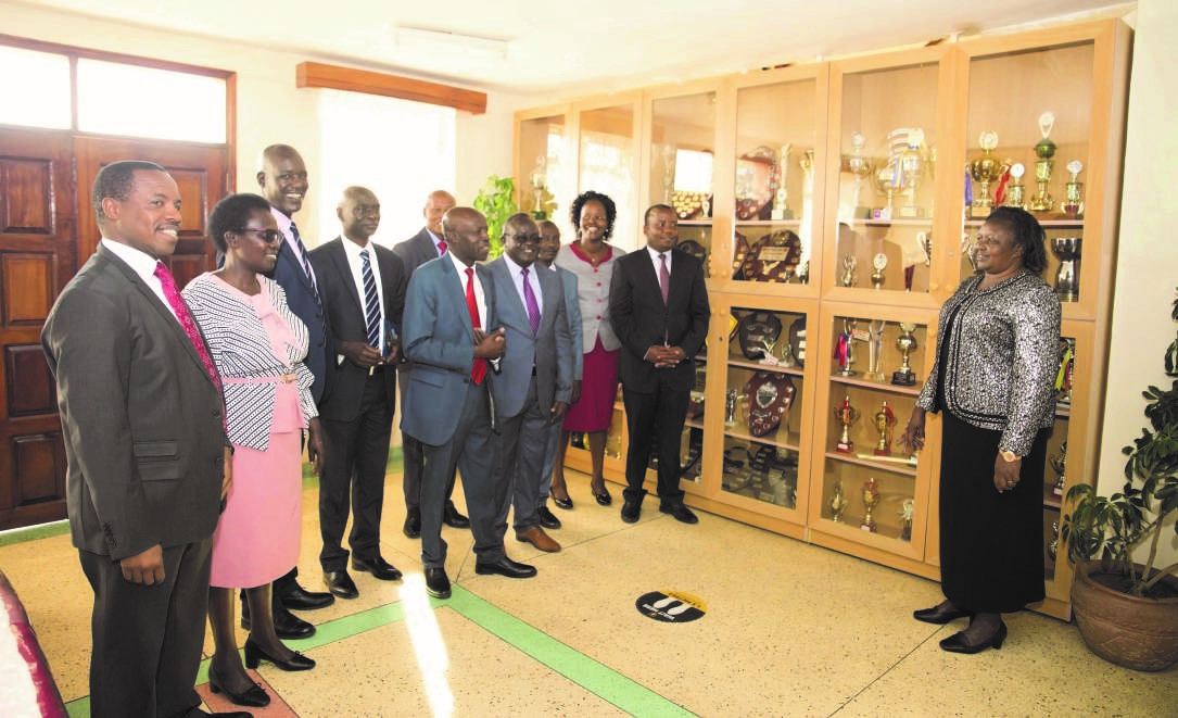 The Chief Principal having a discussion with the school senior management team